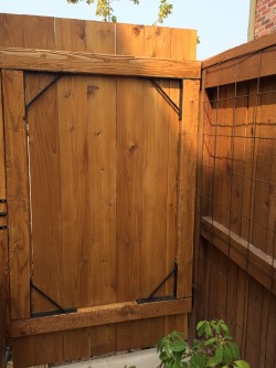 Hand built gates, fine hard cedar clear coat finish.
